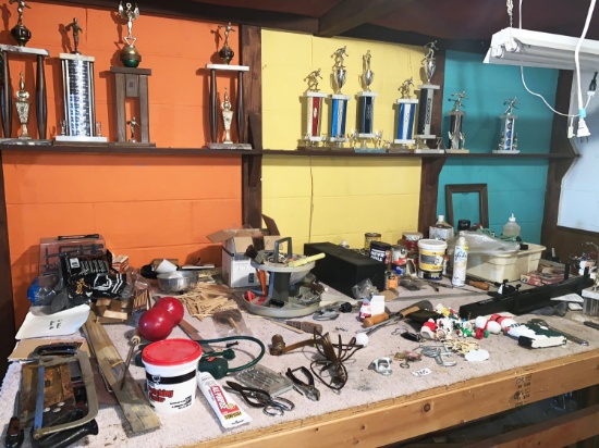 Contents of Work Bench including Vise and Trophies