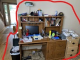 Computer, monitor, trash can, desk, file cabinet, desk contents