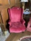 Pair of vintage bright pinkish red upholstered wingback chairs