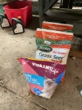 2 bags of Grass Seed and one bag of cat litter