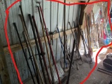 Large lot of assorted hand tools along wall in barn