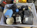 Tote lot of camera flashes, wires, old camera etc