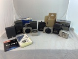 6 Cameras - All Canon ELPH 260's, manuals and rolls of film.