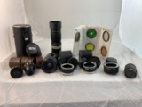 Group of Lenses 7 and Camera Accessories, filters, lens caps and cases.