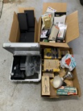 Group Lot to include AC adaptors, Flash Units, VHS cases, light bulbs, and more.