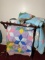 Pair of vintage Comforter Quilts on rack