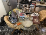 Items on table including silverplate set, food processor etc