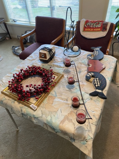 Items on table, two chairs, Coca Cola bag