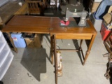 Vintage sewing machine in cabinet