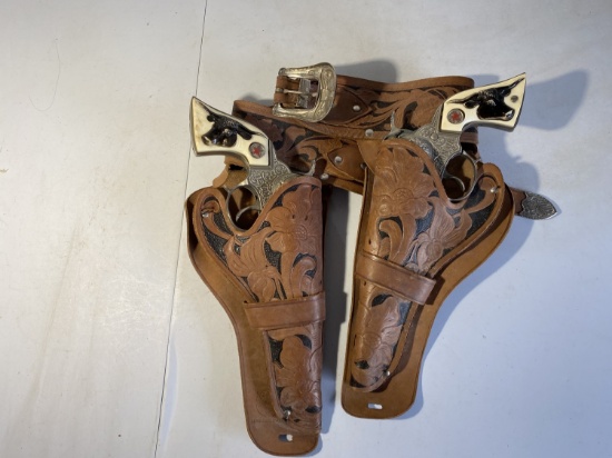 Pair of vintage toy old west pistols and holsters