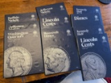 Group of coin album books with coins