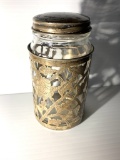 Glass jar with sterling silver overlay and lid.