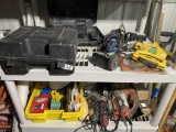 Two shelves of assorted tools and more