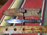 Large vintage fighting knife in sheath