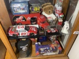 2 Shelves of assorted NASCAR collectible items