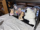 Shelf lot of dolls, anniversary clocks and more