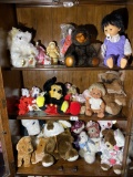 Three shelves of collectible plush and more