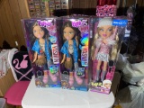 Three Bratz dolls in boxes