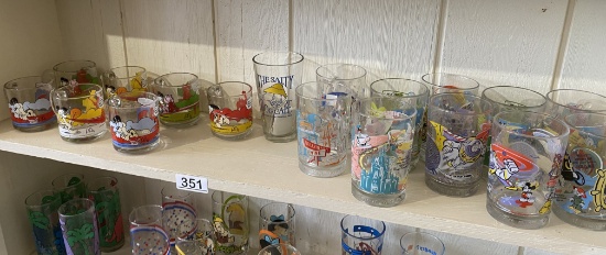 Shelf lot of vintage character glasses