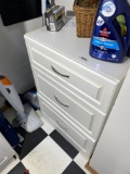 White wooden cabinet with drawers