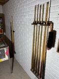 2 racks full of Vintage Pool Cue Sticks