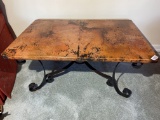 Low table with copper tone top and metallic base
