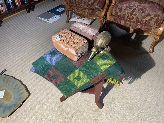 Decorative bricks, brass bird, vintage wool blanket, stand.