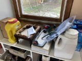 Early stool, tile, bags on shelf