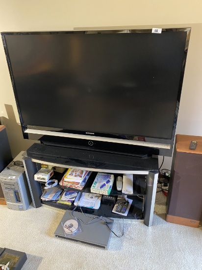 56" Samsung Television, remote, entertainment stand