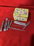 Needle Holders, Ornate Needle, and Enamel Box