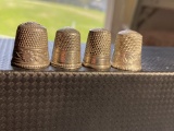 Group of 4 antique sterling silver sewing thimbles