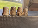 Group of 4 antique sterling silver sewing thimbles