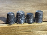 Group of 4 antique sterling silver sewing thimbles