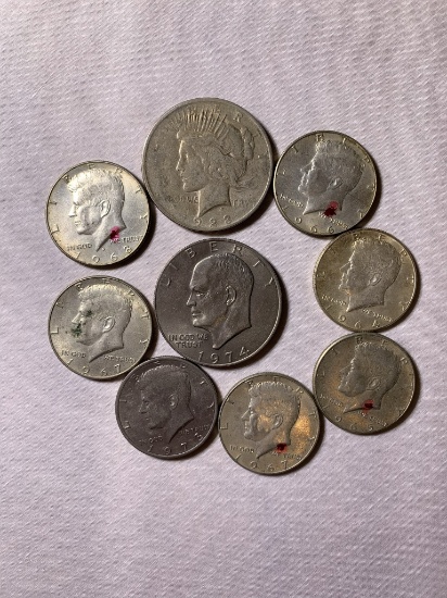 1 1923 Peace Dollar, 1 1974 Ike Dollar, & 7 Kennedy Half Dollars coins