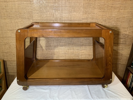 Unusual vintage rolling magazine rack and table.