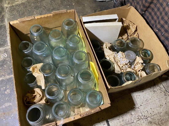 Two boxes of blue canning jars including larger.