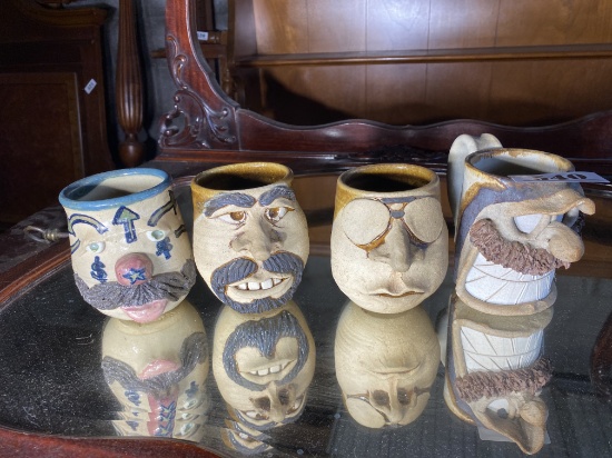 Group lot of four art pottery mugs