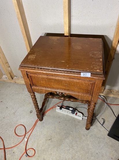 Vintage sewing machine in stand