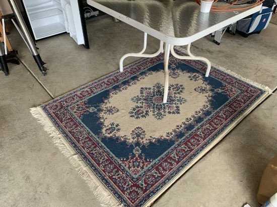 Glass top table and rug
