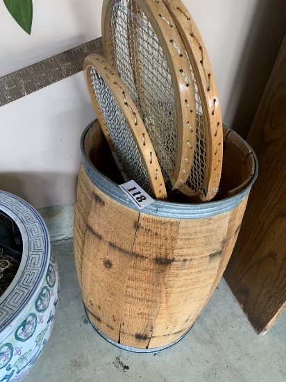 Nail keg and old tennis rackets