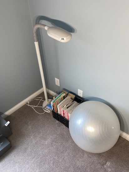 Lamp, magazines, exercise ball.