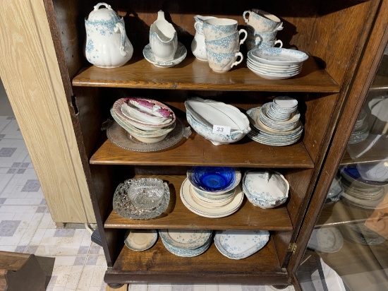 Four shelves of antiques and vintage items