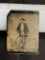 Early tintype of a man with Bicycle