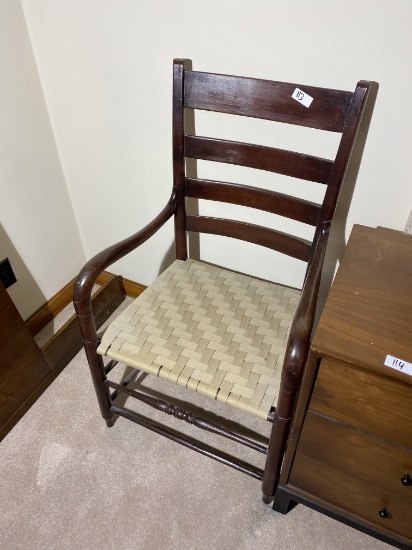 Antique armchair with woven seat