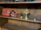 Vintage shelf contents including toys