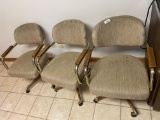 Group lot of three rolling chairs.