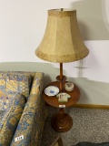 Vintage lamp with items on top of it