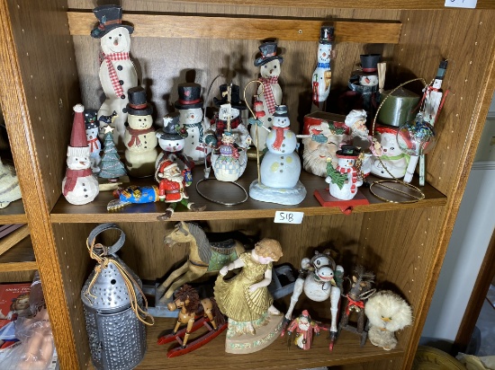 2 Shelves of assorted figurines including Christmas, folky