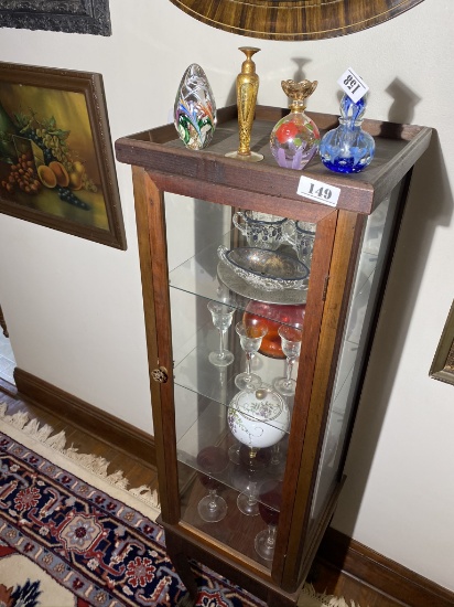 Items inside and on top of curio cabinet