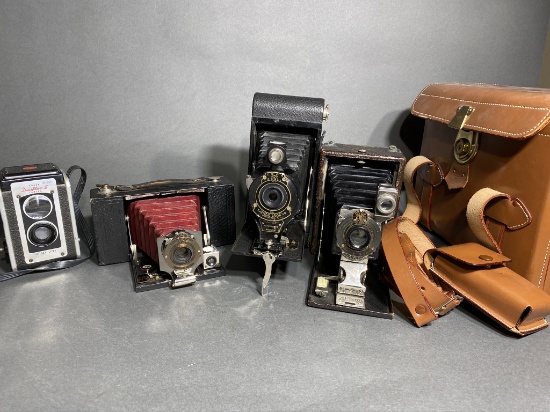 Group lot of antique cameras including red bellows